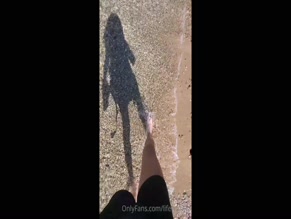 lifewithiu walks barefoot on beach