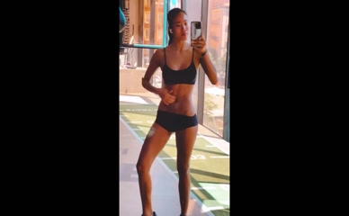 Nona Sobo gym attire, midriff exposed, chest and groin covered by bra and shorts