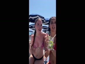Surya.atkinson dancing with her friend in a bikini