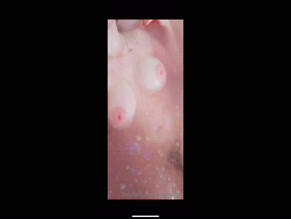 Rileyheartz's bare breasts in the bath.