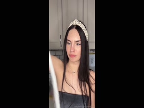 Polinkavip bakes apple cake in bra top and shorts.