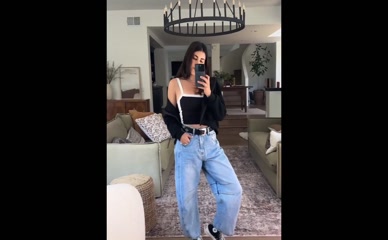 Daniella Monet in top, jeans, and jacket
