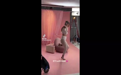 Millie Bobby Brown in bra and leggings dancing.