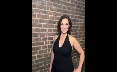 Lee McKenzie in revealing black dress.