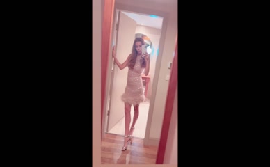 Una Healy mirror selfie in sparkly dress.