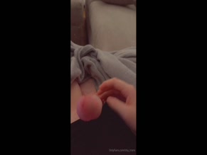 Transgender woman displays erect penis.