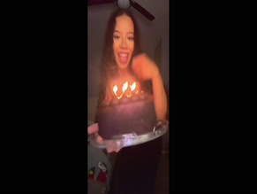 Hot woman grabbing her big ass in tight black dress