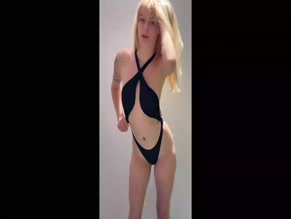 Bridget Williams's bare tits and ass in black swimsuit