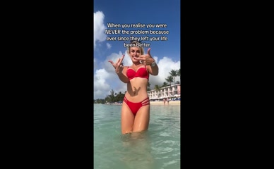 Tallia Storm middle fingers in red bikini.