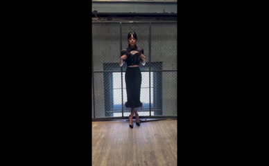 Jenna Ortega in black dress.