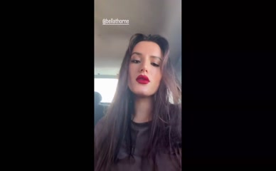 Bella Thorne red lipstick selfie.