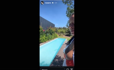Maya Jama poolside cleavage.