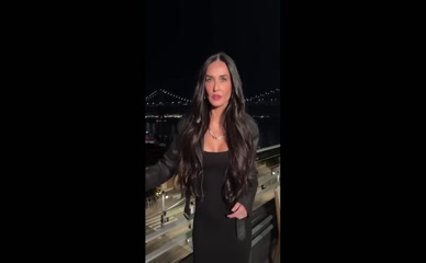 Demi Moore shows off her curves in a tight black dress.