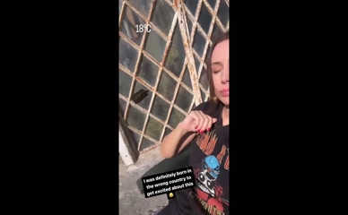 Una Healy sunbathing in t-shirt.