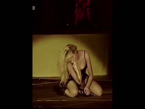 Sabrina Carpenter deepthroats mic on stage.