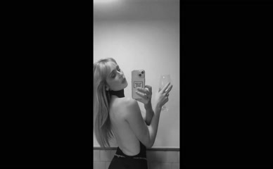 Diana Vickers bare back wine selfie.
