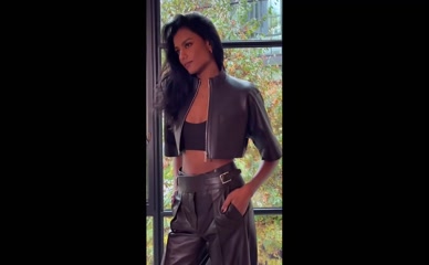 Simone Ashley midriff in leather outfit