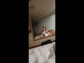 Bruna Trainer topless bubble bath selfie