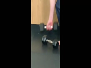 Anne Hathaway bra top dumbbell workout
