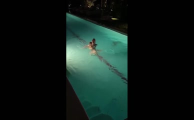 Madison Beer topless in pool.