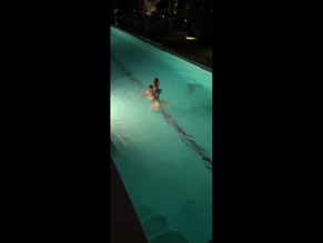 Madison Beer topless in pool.