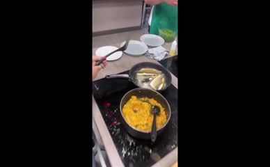 Millie Gibson cooking fish.