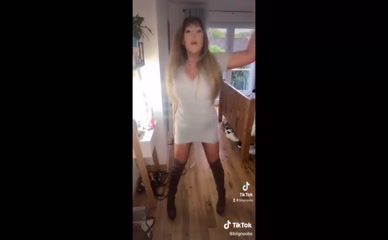 Danni Nicholls dances in a short dress.