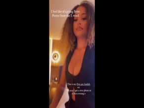 Amber Gill's cleavage in open vest.