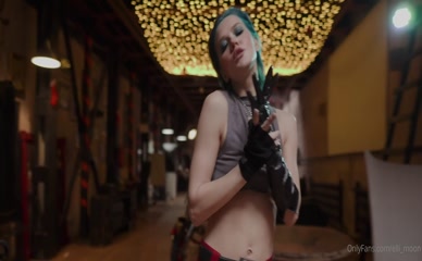 Elli Moon topless with prop weapon.