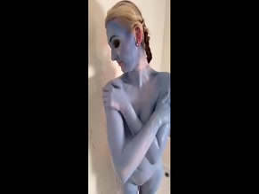 Em-Yang: Blue Body Paint and Exposed Breasts