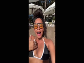 Amber Gill in bikini top.
