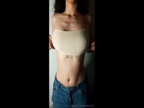 lauralatinfree reveals tattoo under tube top