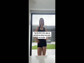 Allie Sherlock's Tour Announcement in Black Tank Top and Shorts