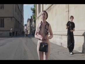 Nude ActivistsWoman's bare breasts and butt on public street.