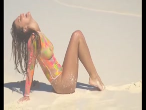 Nina Agdal topless beach photoshoot.