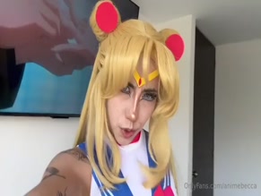 animebecca: Sailor Moon cosplay with exposed upper body and visible cleavage