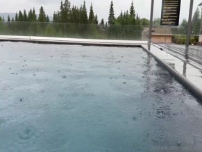 sultedsult Outdoor pool, rain, no people visible