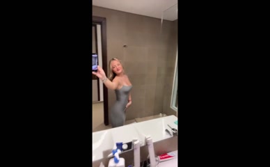 Daisy Campbell bathroom selfie cleavage tease.