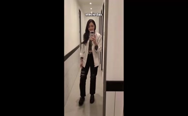 Jane Douglas wearing shirt and pants