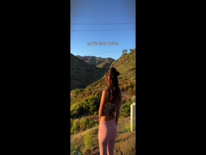 Victoria Justice dances in a crop top and skirt.