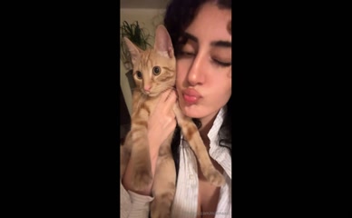 milenaasl exposed cleavage with cat