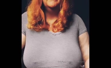 Curvy redhead reveals tits
