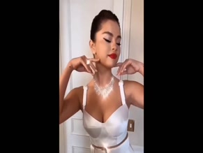 Selena Gomez00:00 Prominent cleavage visible.