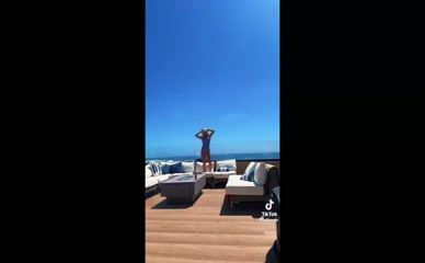 Ella Horan: Swimsuit Cleavage and Bare Back Exposure.
