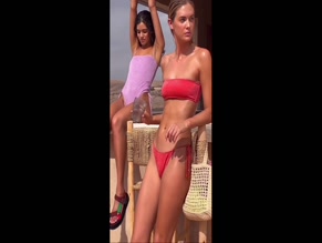 Megan Williams in red bikini, ass close-up