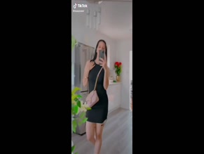 TikTok girl in black dress.