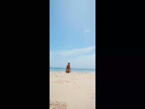 Sophie Pettifer nude beach kneeling