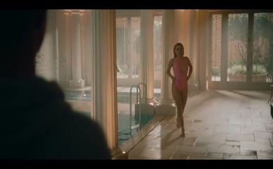 Alana Boden topless in pink swimsuit.