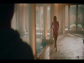 Alana Boden topless in pink swimsuit.