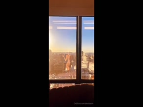 Alexis Belon showing her naked body in the window
